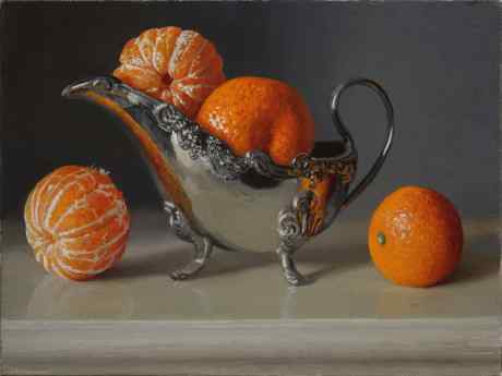 Oranges with a silver cup